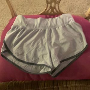 Stretch with drawstring zipper pouch on back
